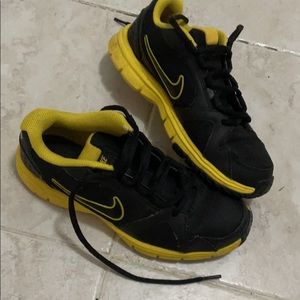 Black and yellow Nike sneakers